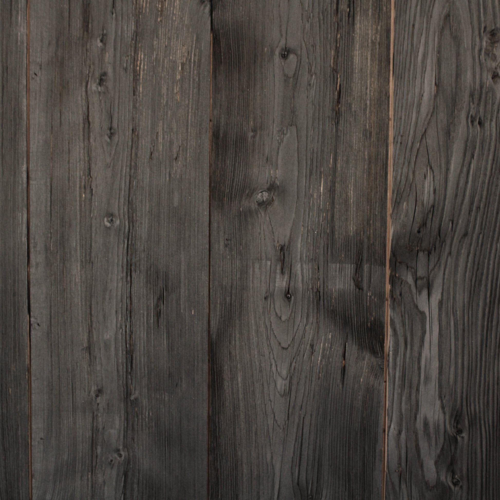 Close-up of dark wooden planks with visible grain and texture